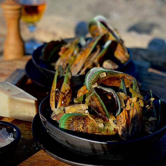 Mussels served in Old Dutch on the beach